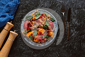 top view of delicious salad with mussels, vegetables and jamon